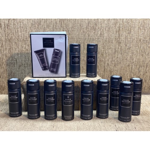 518 - 12 cans of David Beckham deodorant.