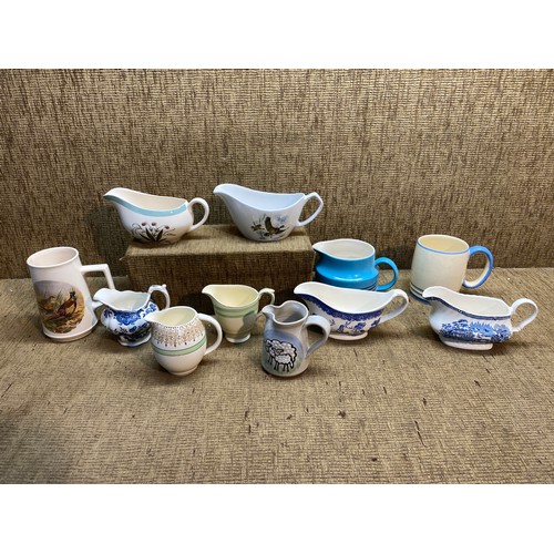 317 - Collection of Ceramics including: gravy boats and mugs.