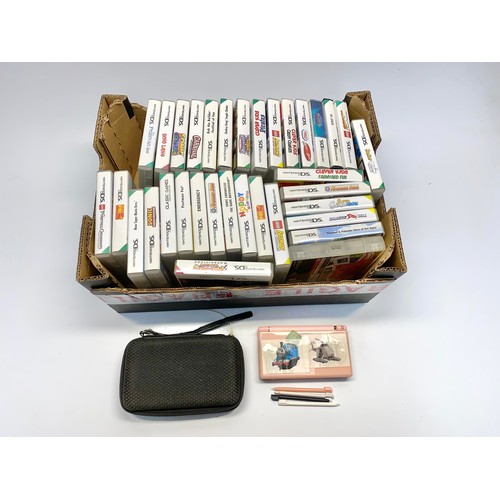 522 - Nintendo DS console with two games and a selection of Empty games boxes with instructions.