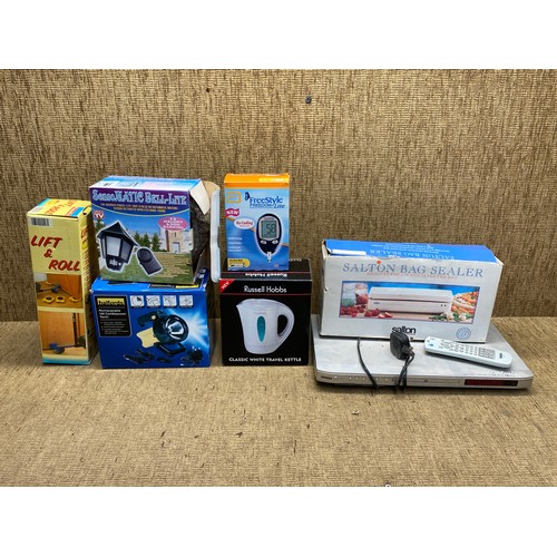 329 - Retail boxed items including: furniture lift and roll, re-chargeable Halfords torch and a vacuum bag... 