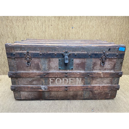 1239 - Large antique rustic steamer trunk on wheels.