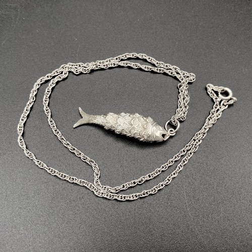 848 - Silver articulated fish and chain.