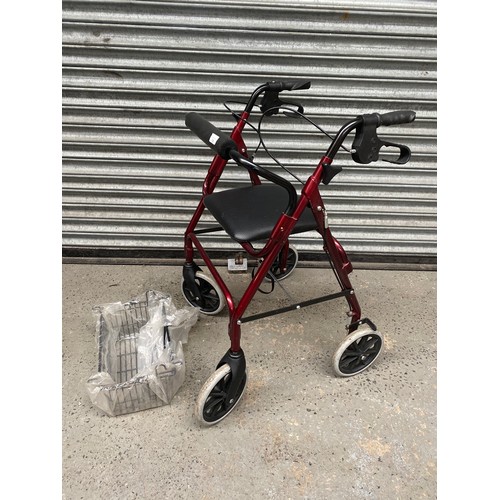 76 - 4 wheel mobility aid walker with basket.