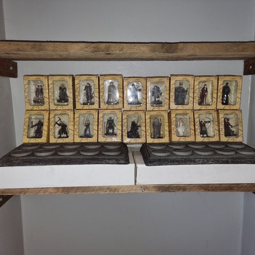 475 - Collection of boxed Lord of the rings lead figures and two original display stands.