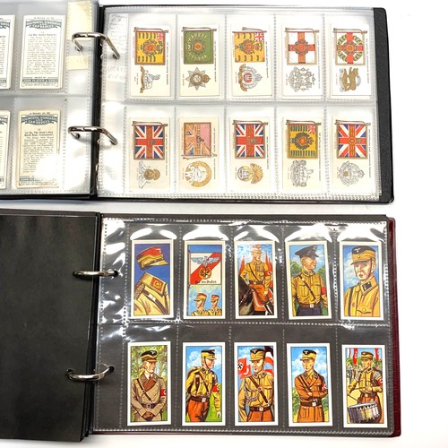 1128 - Two albums of military cigarette cards ( 698 cards).