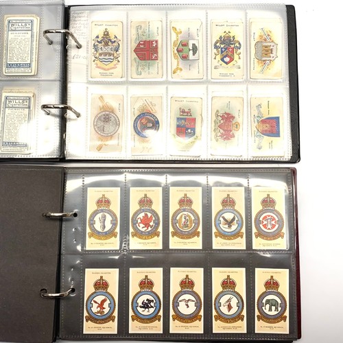 1128 - Two albums of military cigarette cards ( 698 cards).