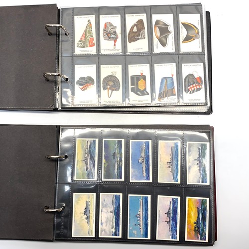 1128 - Two albums of military cigarette cards ( 698 cards).