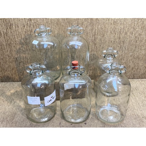 101 - 6 glass Demijohns.