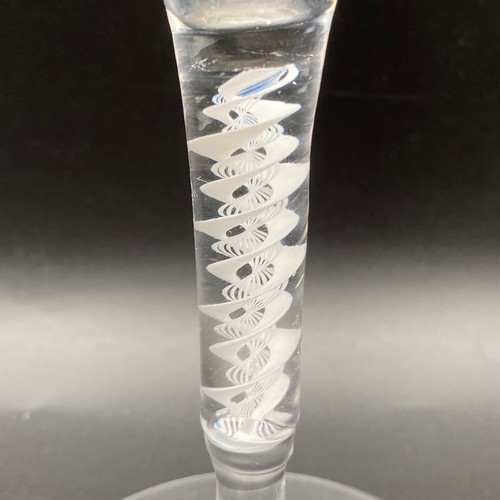 713 - 19th century wine crystal with cotton twist in the stem.slight chip to base.19cm tall.