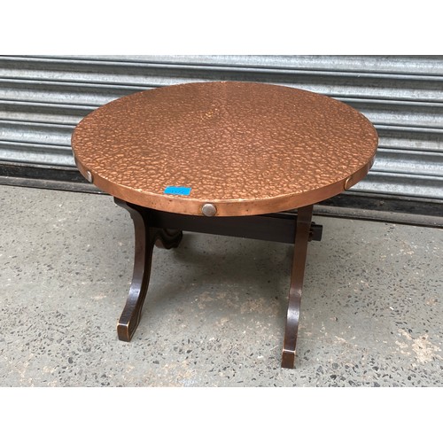 1177 - Arts and craft hand beaten copper plated occasional table.