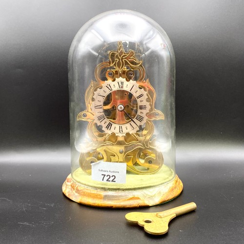 722 - Hand etched victorian style brass skeleton clock in glass case and marble base. Key included. 19cm.