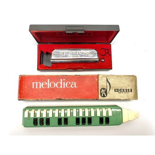 732 - Hohner Melodica in case and Session Harmonics Harmonica in case.