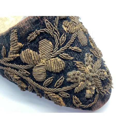 743 - Pair of handcrafted and embroiled antique women's shoes and wrist embroidery.