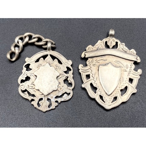 892 - Two sterling silver fobs.