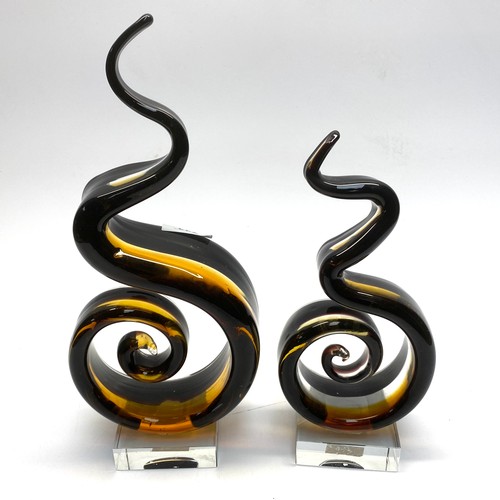 744 - 2 half smoked glass spiral studio glass ornaments.

Largest height: 34cm