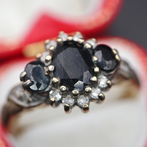 950 - 9ct gold cluster ring with black diamonds. 4g size S.