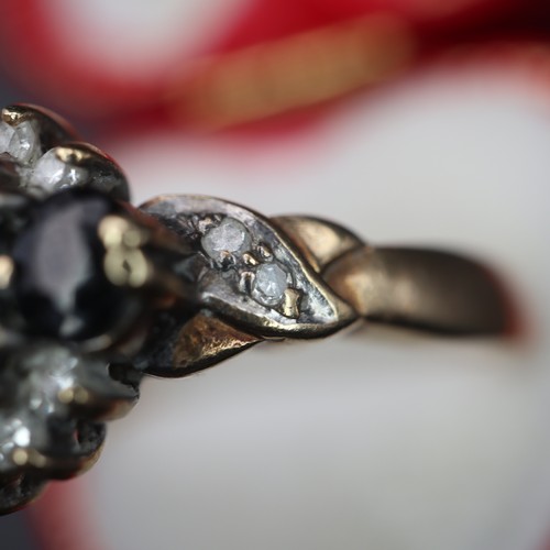 950 - 9ct gold cluster ring with black diamonds. 4g size S.