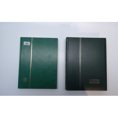 754 - Two stamp albums in mint condition (all fresh to auction).