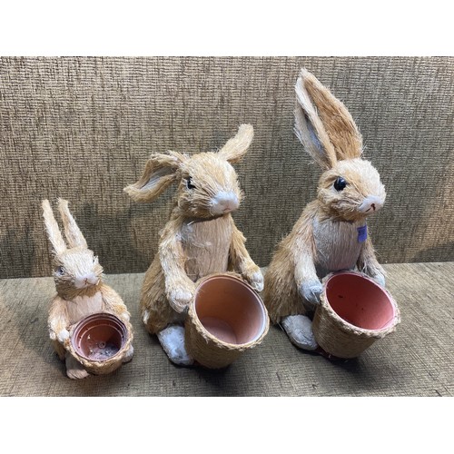 518 - 3 straw furred rabbit garden planters.