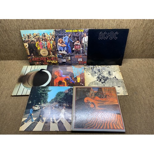 1244 - Selection of 10 vinyls including: AC/DC, The Who and The Beatles.