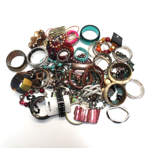 456 - Large selection of costume jewellery mainly bangles.