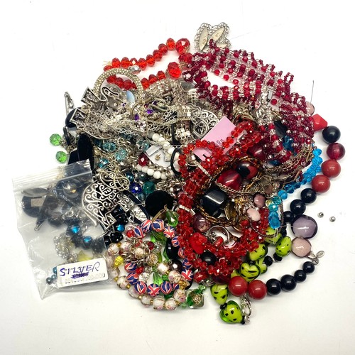 466 - Large bag of various costume jewellery including some silver.