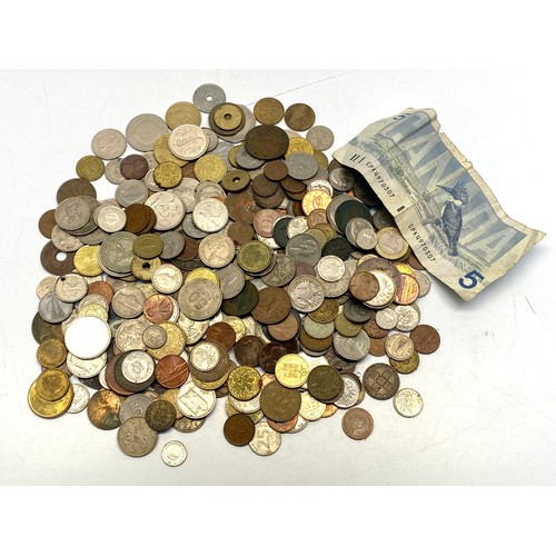 854 - Large quantity of coins and notes.