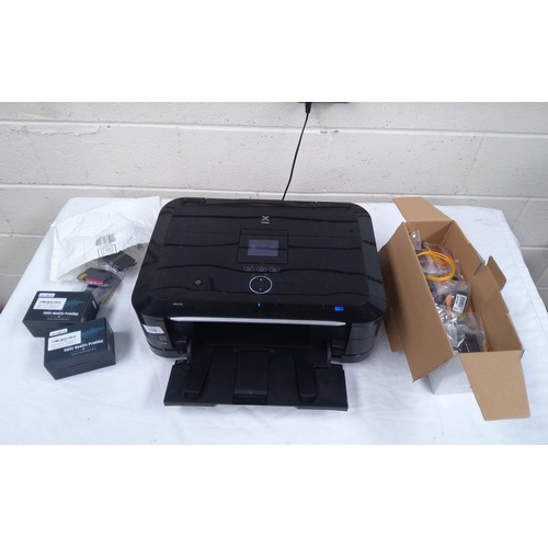 115 - Canon pixma wireless printer with a large amount of printer ink.