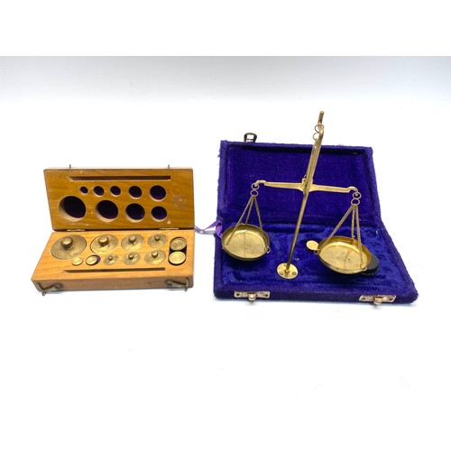 751 - vintage brass weighing scales and weights in cases.