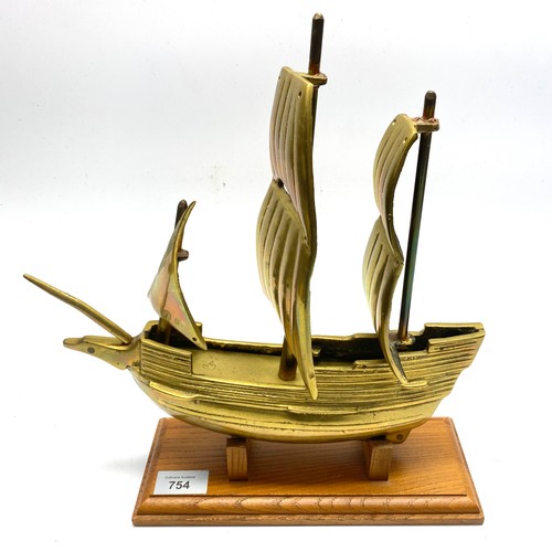 754 - Hand made brass galleon on wooden stand, signed J.B.P.

Length: 32cm.