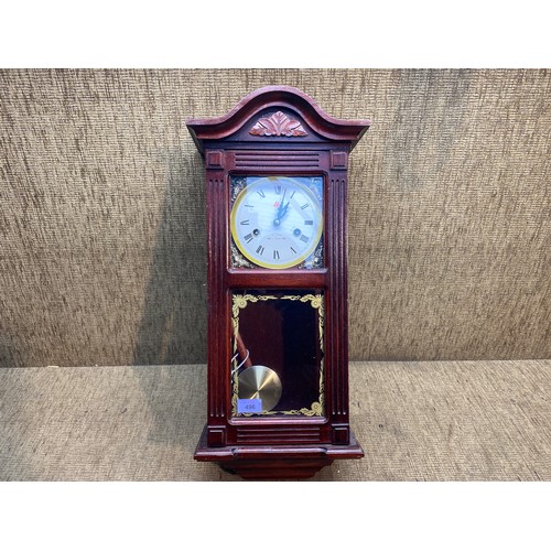 496 - 31 day chime wooden wall hanging clock.

height: 59cm.