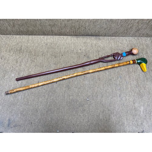 1120 - 2 hand crafted walking sticks: including 1 hand painted mallod.