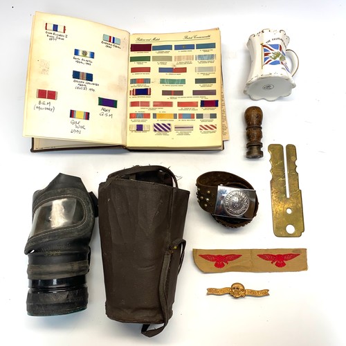 1127 - Selection of military memorabilia items including: A ribbons and medals collectors book and a 1980s ... 