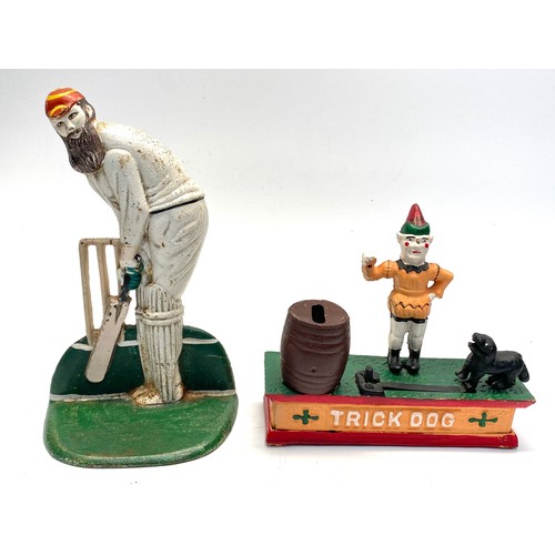 1133 - 2 cast iron items including: cricketer door stop and spring loaded trick dog money box (reproduction... 