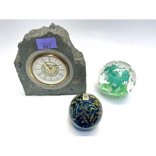 527 - 2 paper weights including: medina glass and Mercedes clock encased in stone.