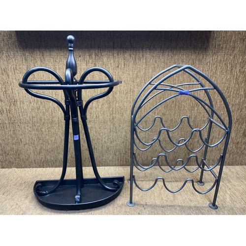 515 - 2 cast metal items including: Umbrella stand and a wine rack. 76cm.