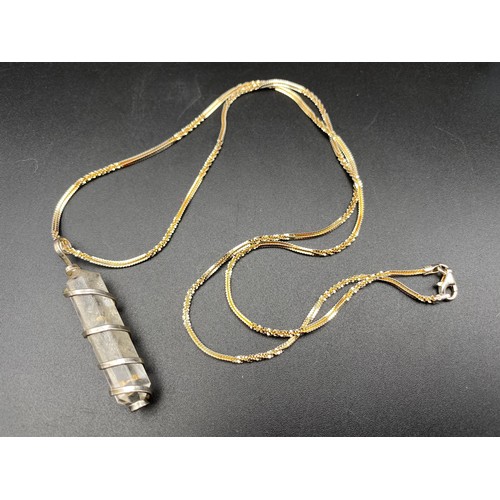 816 - Interesting handmade silver wrapped pendant and chain.