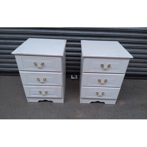 207 - A pair of three drawer white bedside tables