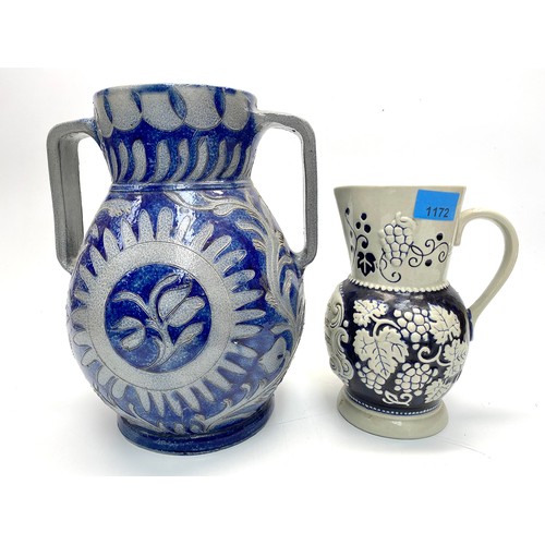 1172 - 2 ceramic vases including: German pouring jug. (Largest 28cm)