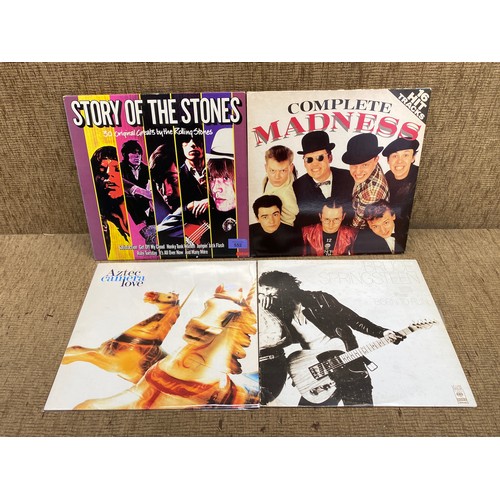 552 - collection of vinyl record including: Rolling Stones and Madness.