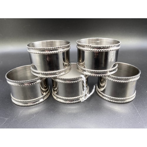 557 - Five white metal machined and polished napkin rings in excellent condition.