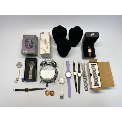 568 - Mixed items including retail package watches, fitness trackers and warts clock.