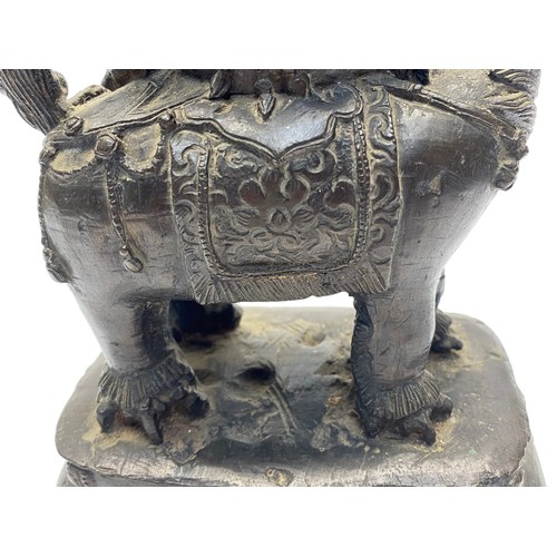 858 - Early Chinese Bronze figure of a Bodhisattva Manjushri sitting on a lion. 23cm tall. Possibly Tibet ... 