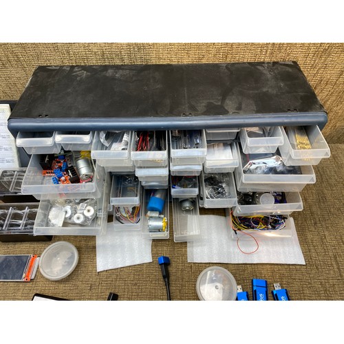 304 - Plastic wall hanging unit filled with computer components and a small box of dongles and movidius ne... 