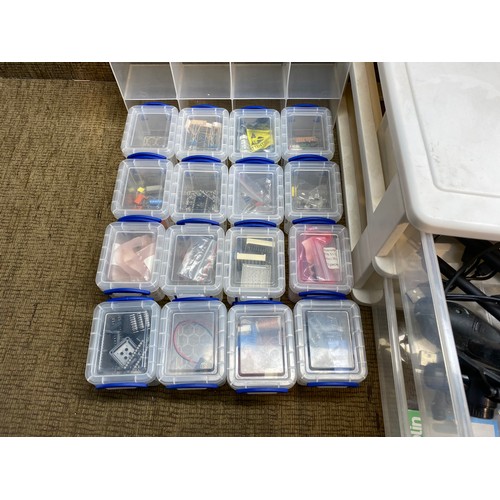 311 - 4 plastic storage containers with large quantity of computer repair equipment.