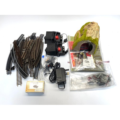 1170A - Selection of model 00 gauge railway track including: controllers and materials.