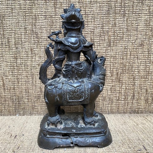 858 - Early Chinese Bronze figure of a Bodhisattva Manjushri sitting on a lion. 23cm tall. Possibly Tibet ... 