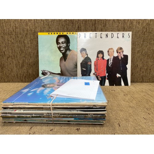 654 - Vinyl record albums including: George Benson, The Pretenders and Status Quo.