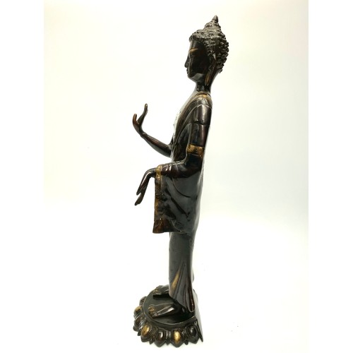 704 - Large brass ornate sculpture of a Tibetan Buddha. (possibly 1900s). Height: 54cm.