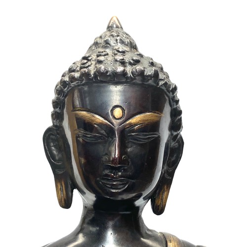 704 - Large brass ornate sculpture of a Tibetan Buddha. (possibly 1900s). Height: 54cm.